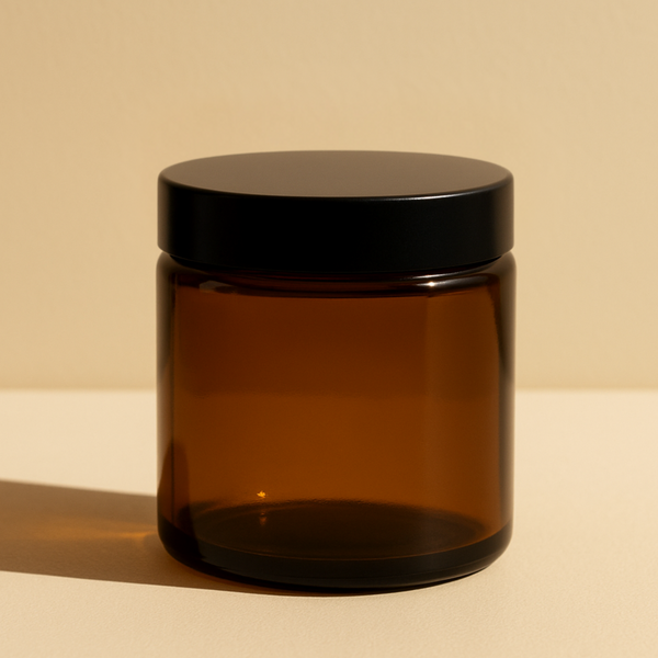Amber Glass Jar with a Black Cap on a Beige Background