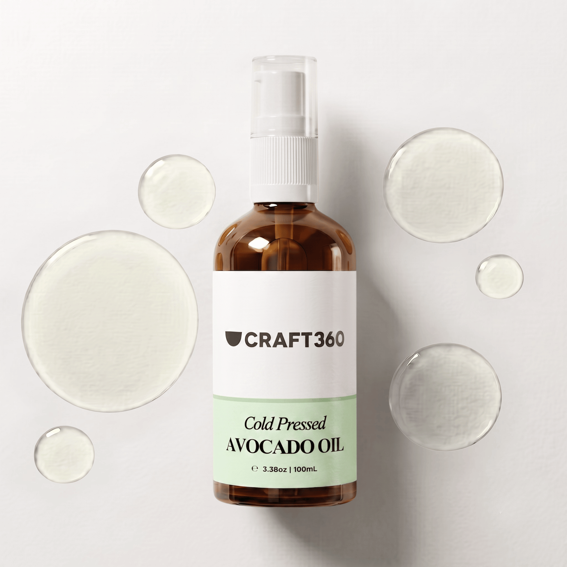 100 ml bottle of Avocado Oil surrounded by pools of natural carrier oil