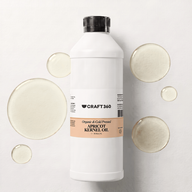 1 L bottle of Apricot Kernel Oil surrounded by pools of pale golden oil