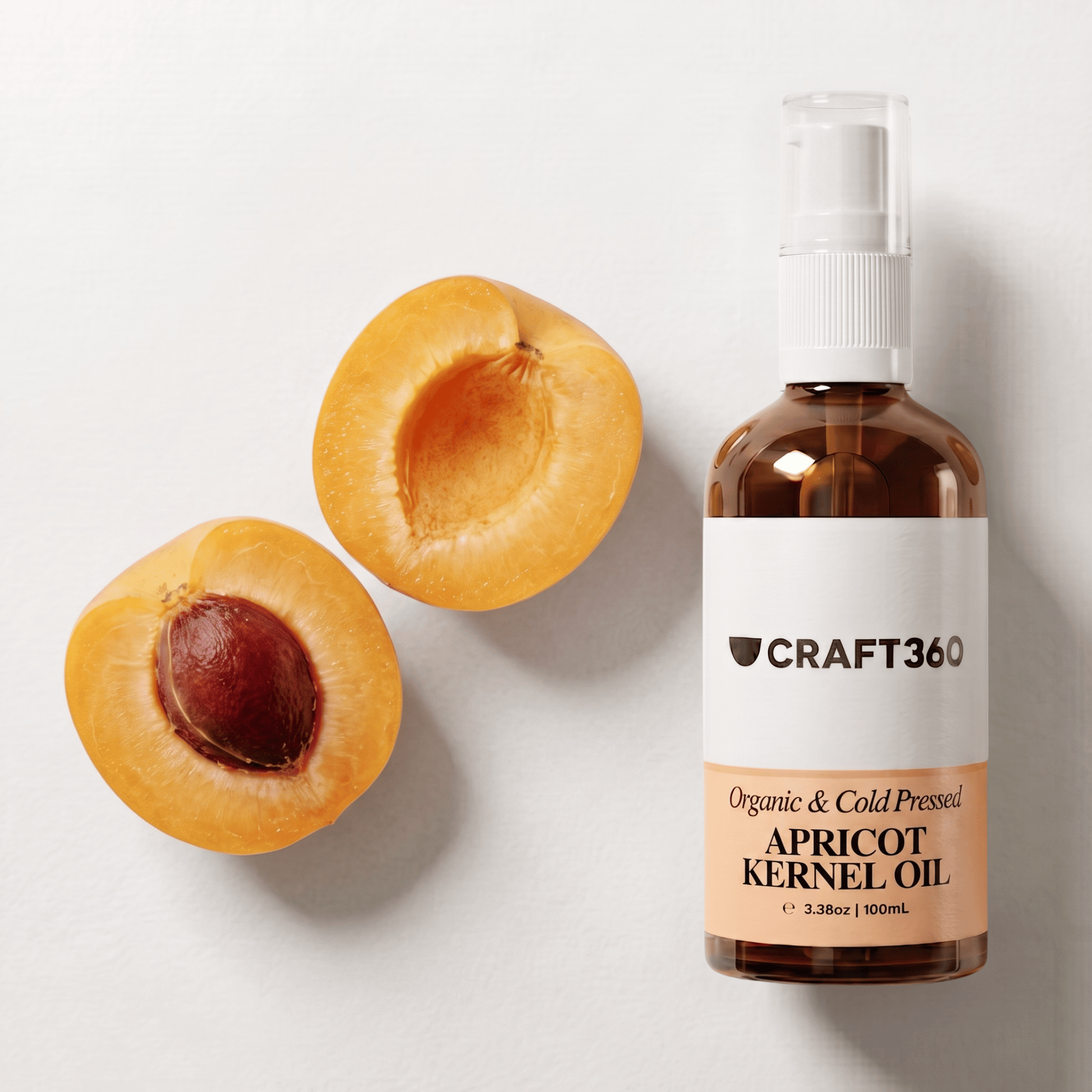 Apricot Kernel Oil displayed beside fresh apricots showing its natural botanical source