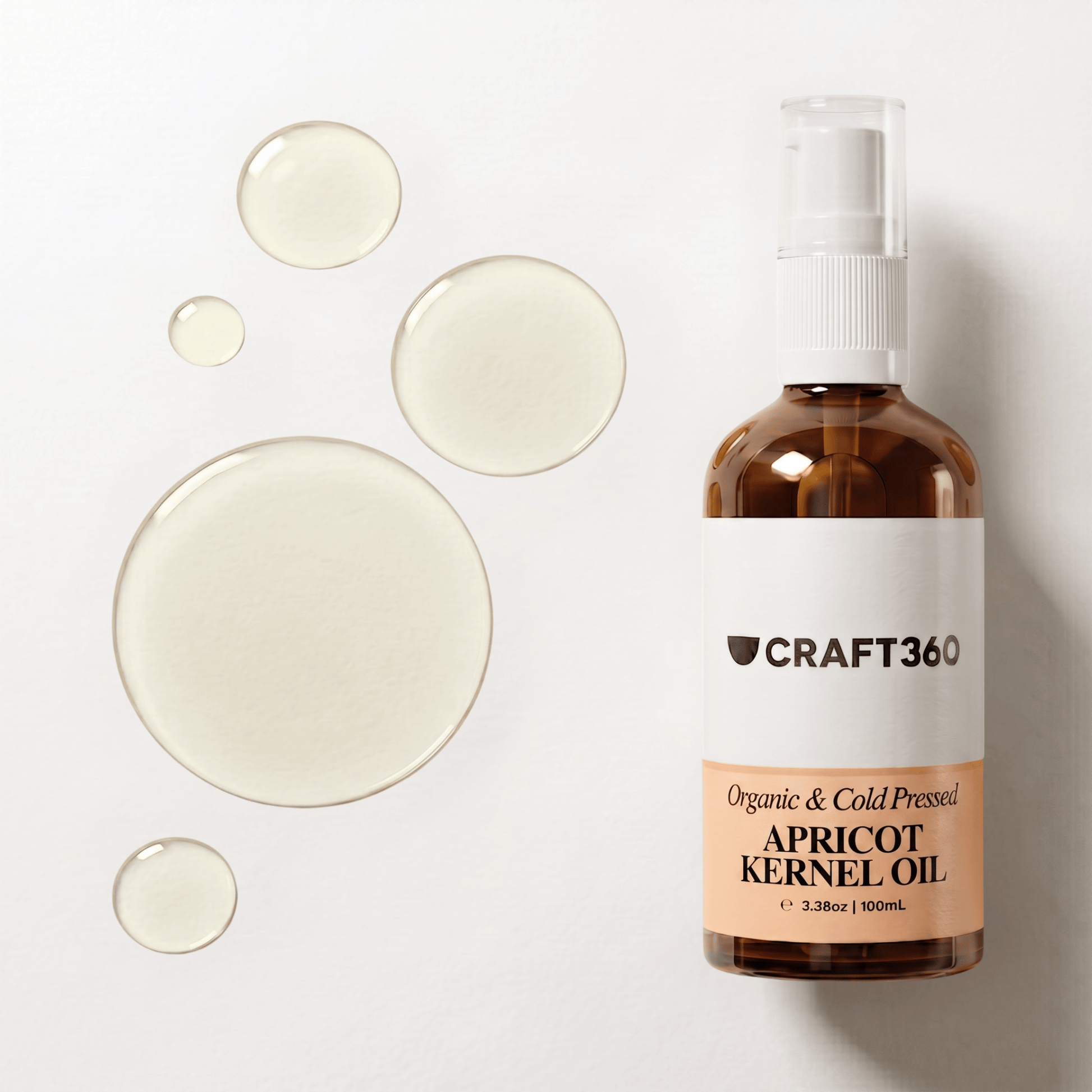 Apricot Kernel Oil in a Craft 360 amber glass pump bottle with oil droplets